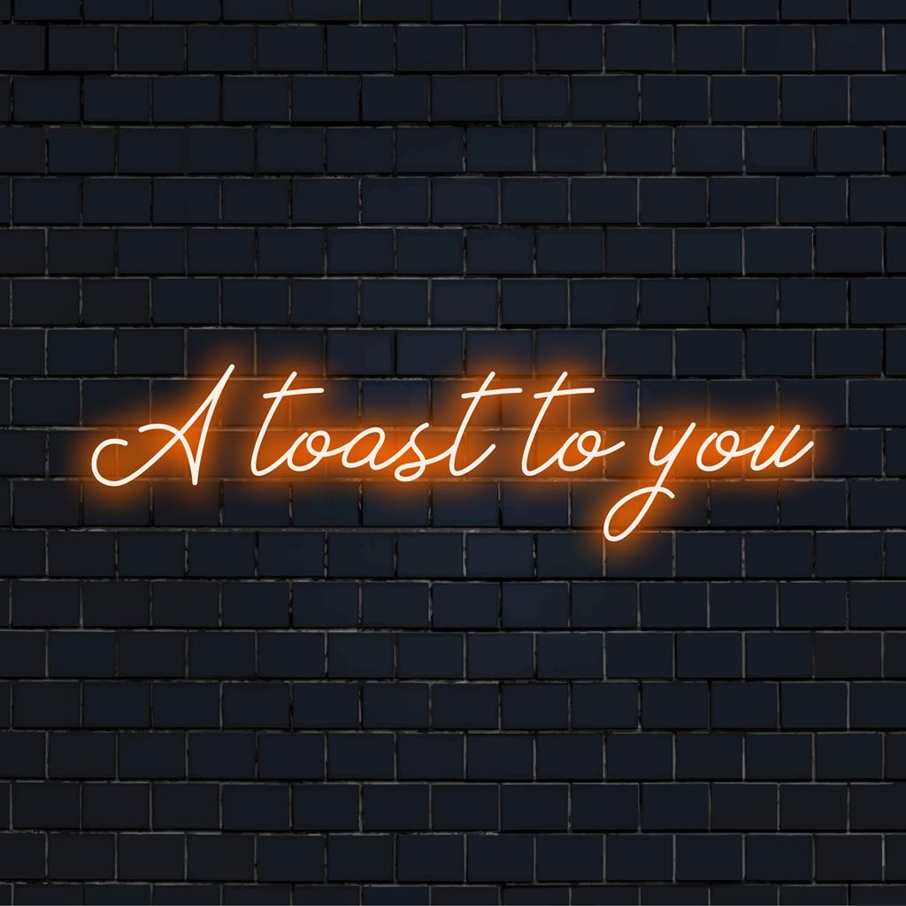 Speciaal LED-neonbord met de tekst A Toast To You in levendige kleuren, perfect om elke ruimte een feestelijk tintje te geven.