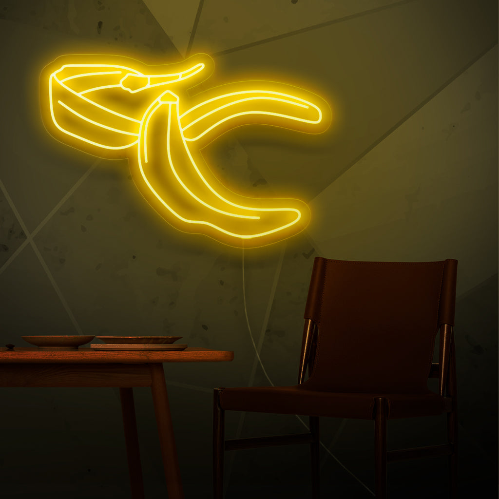 "Banana Peel Neon Sign" - Een eigenzinnig neonlicht met de speelse afbeelding van een bananenschil, dat humor en vrolijkheid in uw leefruimte brengt.