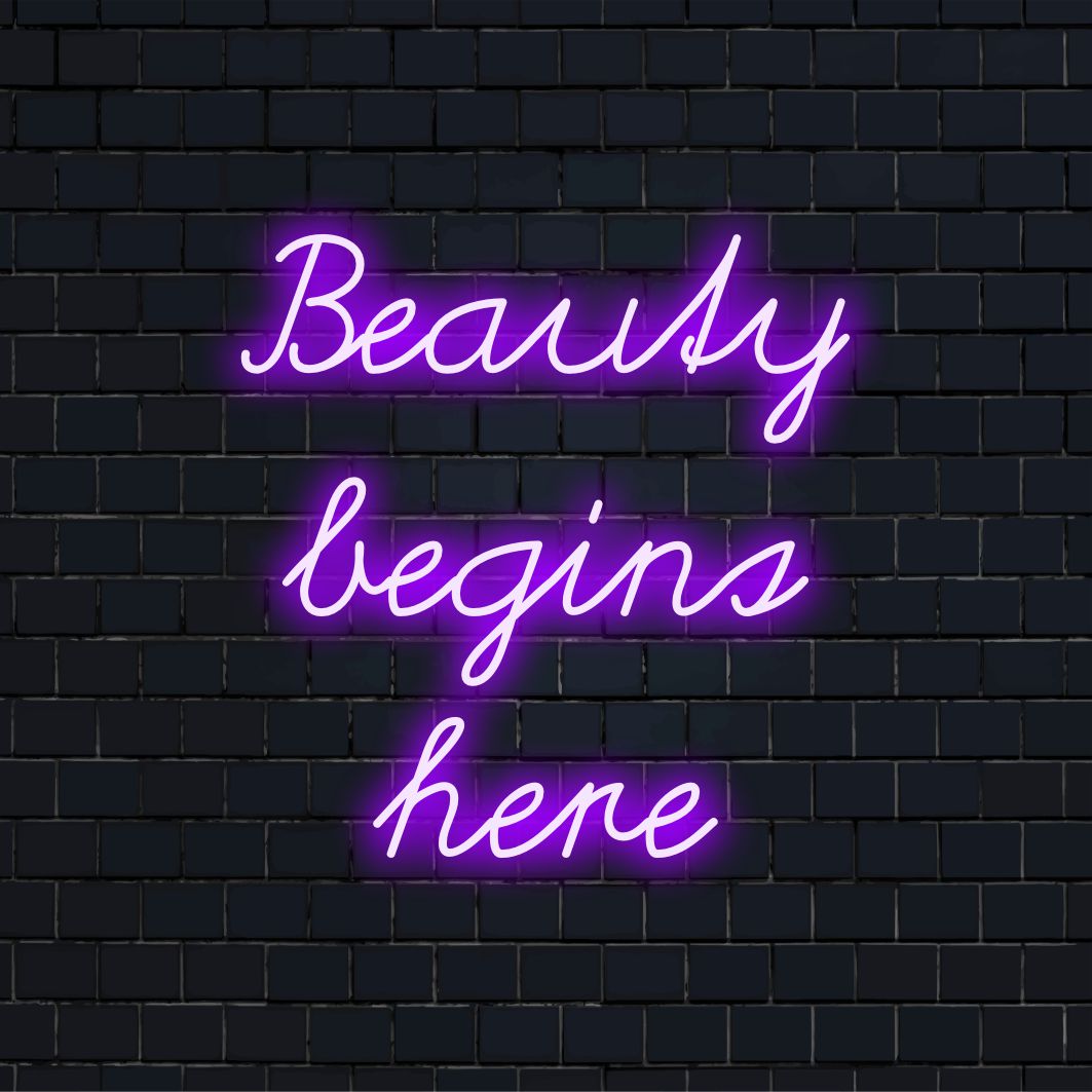 Veelzijdig LED-neonbord met de tekst Beauty Begins Here, dat neoncitaten combineert met op maat gemaakte LED-ontwerpelementen.