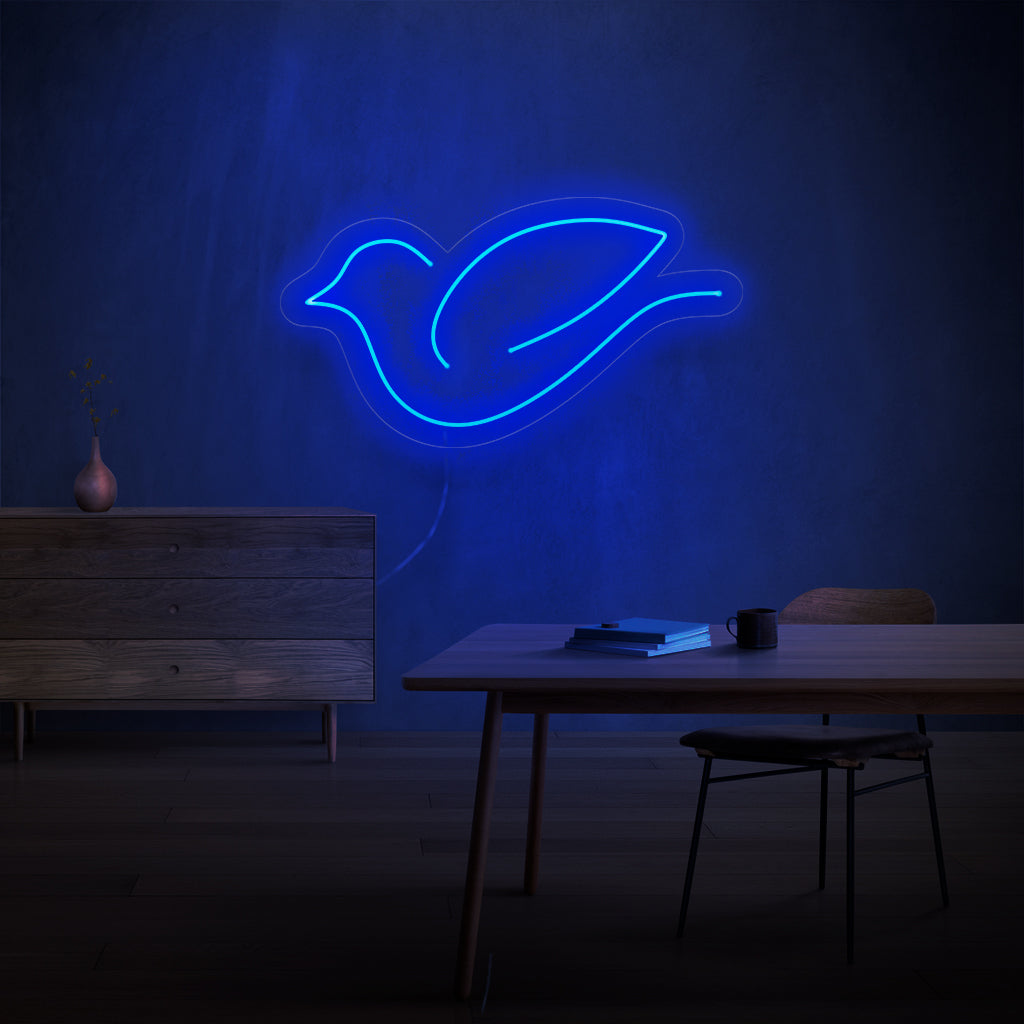 "Bird Neon Sign" - Een speels neonlicht met het charmante silhouet van een vogel, dat betovering en een verbinding met de natuurlijke wereld in uw leefruimte brengt.