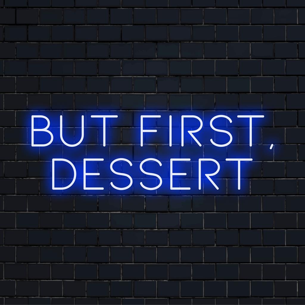 LED-neonbord met de tekst 'But First, Dessert' in felroze, een speelse boodschap die perfect is voor zoetekauwen.