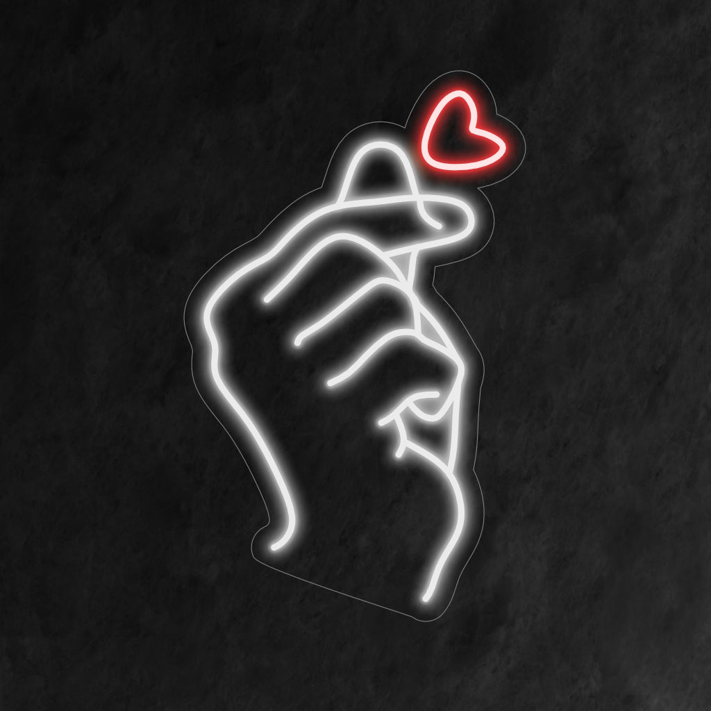 "Finger Heart Neon Sign" licht op met liefde, perfect voor ruimtes die positiviteit omarmen en het hartverwarmende gebaar van het vingerhart, wat een schattig tintje aan de sfeer toevoegt.