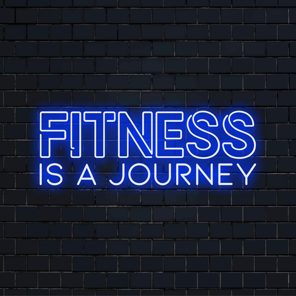 Een aangepast LED-neonbord met de tekst Fitness Is A Journey, perfect om uw ruimte te voorzien van motiverende neonverlichting.