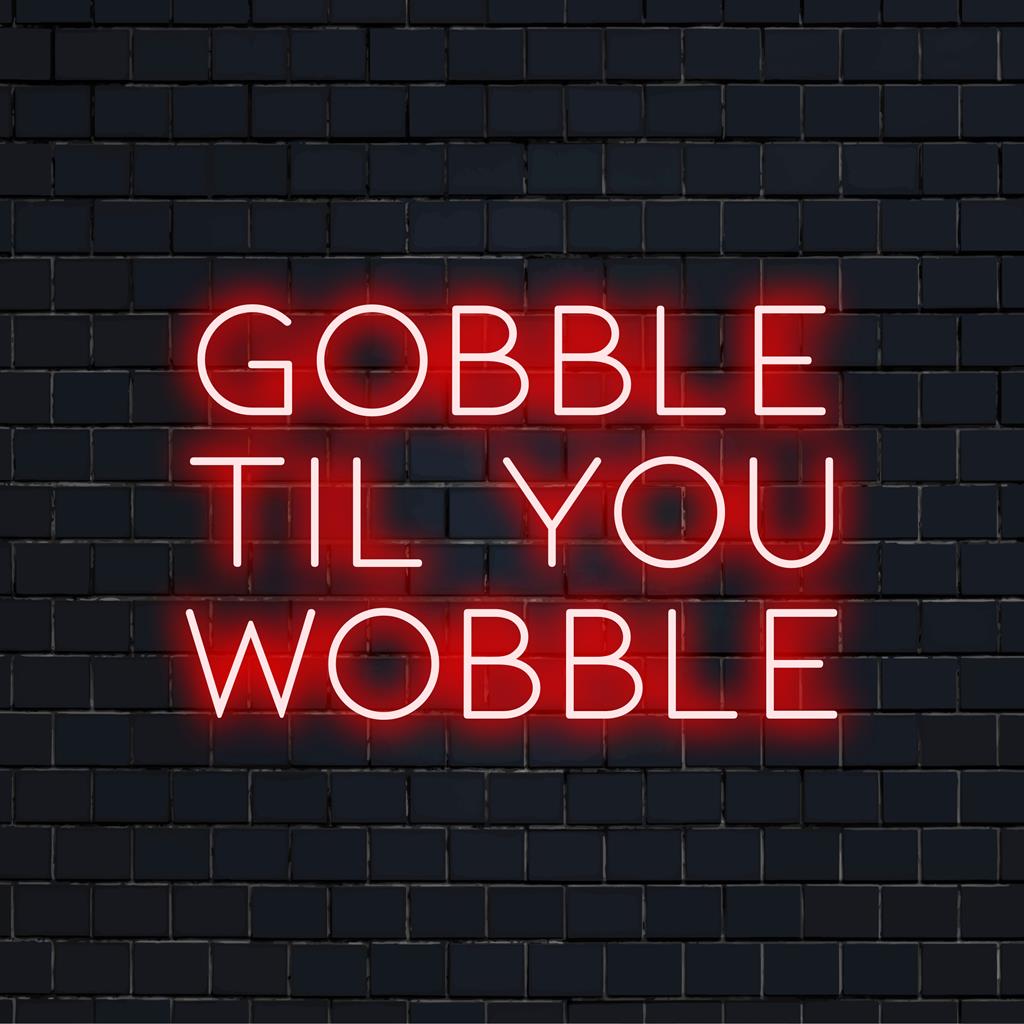 Een op maat gemaakt LED-neonbord met de grappige tekst 'Gobble Til You Wobble', perfect voor feestelijke neondecoraties.