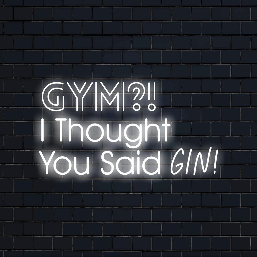 Een felroze en blauw neonbord met de tekst 'Gym? Ik dacht dat je gin!' voegt speelsheid toe aan je interieur, vol met vrolijke vrolijkheid.