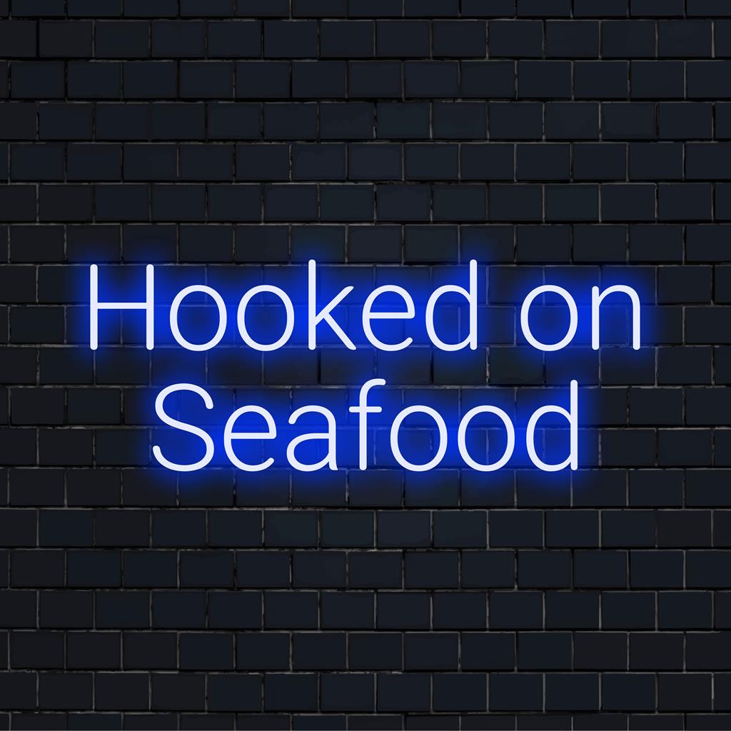 Op maat gemaakt LED-neonbord met de tekst 'Hooked On Seafood' ��� levendig neonlicht, perfect voor een decoratie met een oceaanthema of een persoonlijke ambiance.