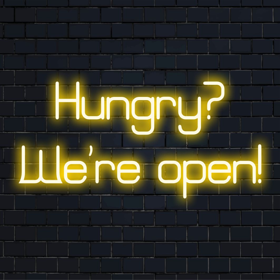 LED-neonreclame met de tekst 'Hungry We're Open!' in levendige kleuren, perfect voor het verfraaien van elke ruimte met uitnodigende neonverlichting.