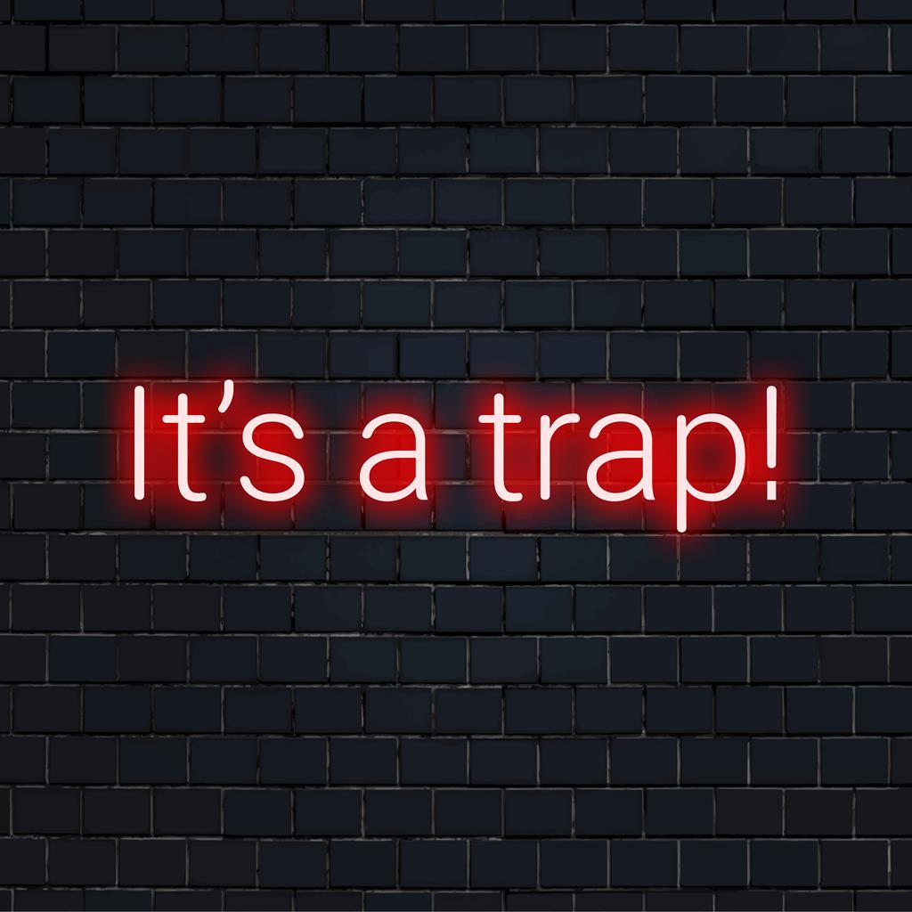 Op maat gemaakt LED-neonbord met de tekst It's A Trap! in een felle, opvallende neongloed, perfect voor een unieke wanddecoratie.