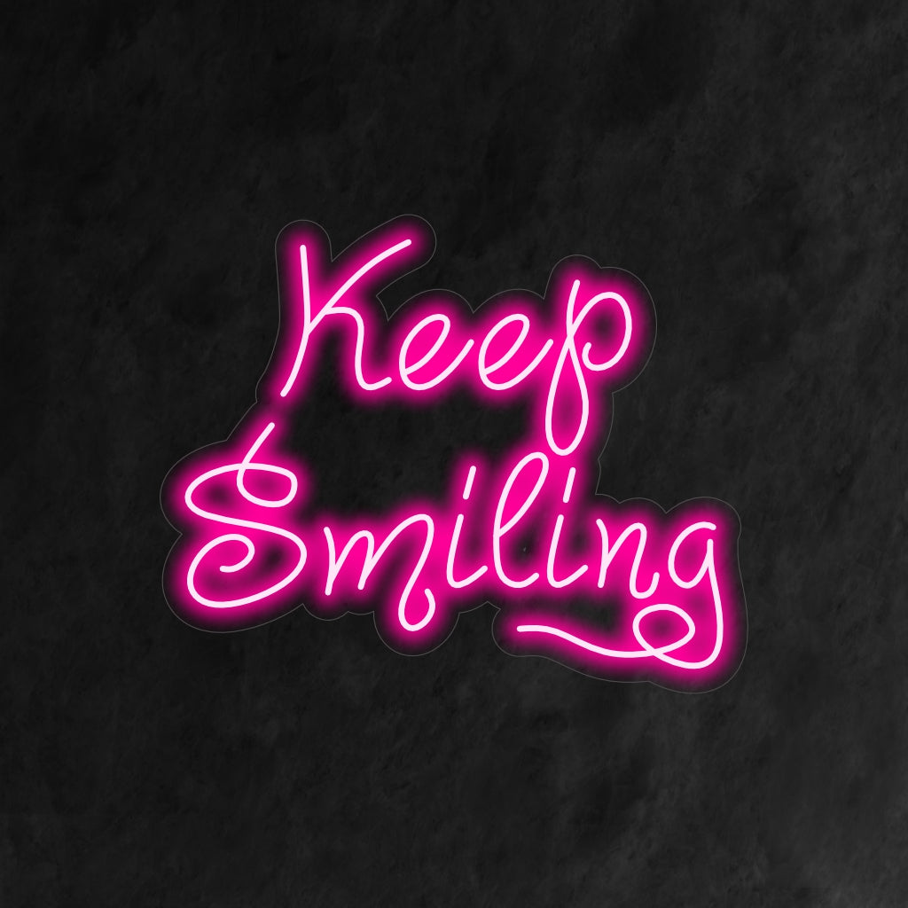 "Keep Smiling Neon Sign" is een motiverende en positieve toevoeging aan je interieur. Een neonlamp die je er dagelijks aan herinnert om vrolijk te blijven.