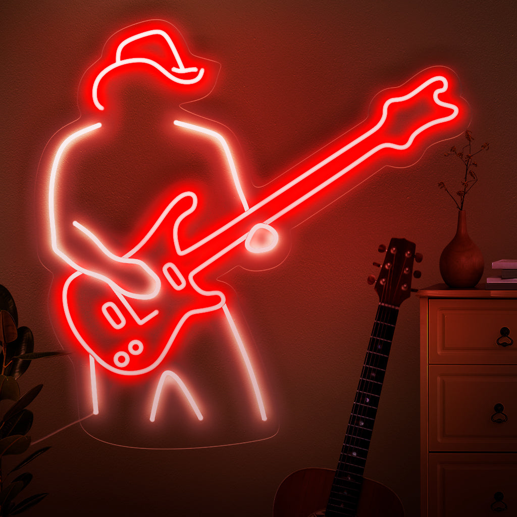 "A Man Plays The Guitar Neon Sign" legt de essentie van muzikale passie vast met een silhouet dat gitaar speelt. Verrijk je ruimte met de ritmische gloed van deze stijlvolle en betoverende neonlamp.