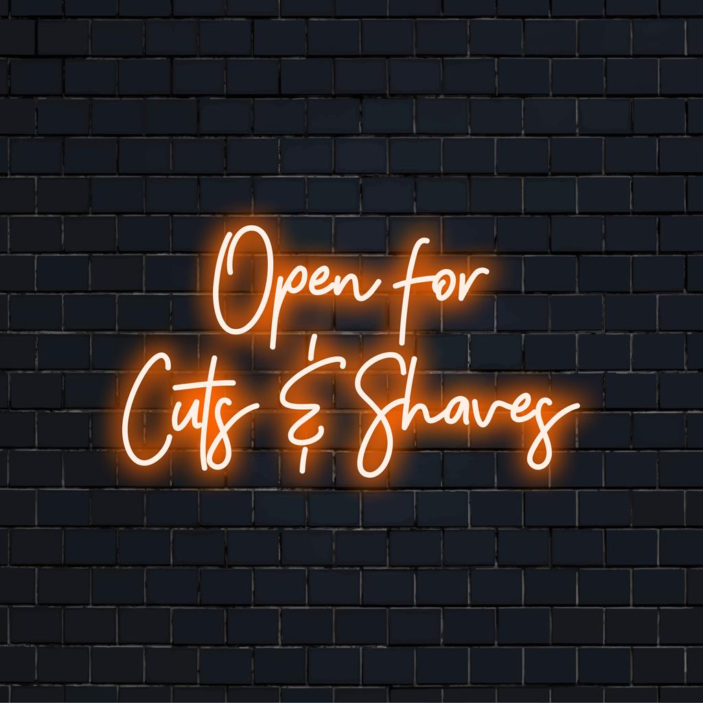 LED-neonreclame met de tekst 'Open For Cuts Shaves'; perfect voor kapperszaken, een combinatie van kunst en gastvrije charme.