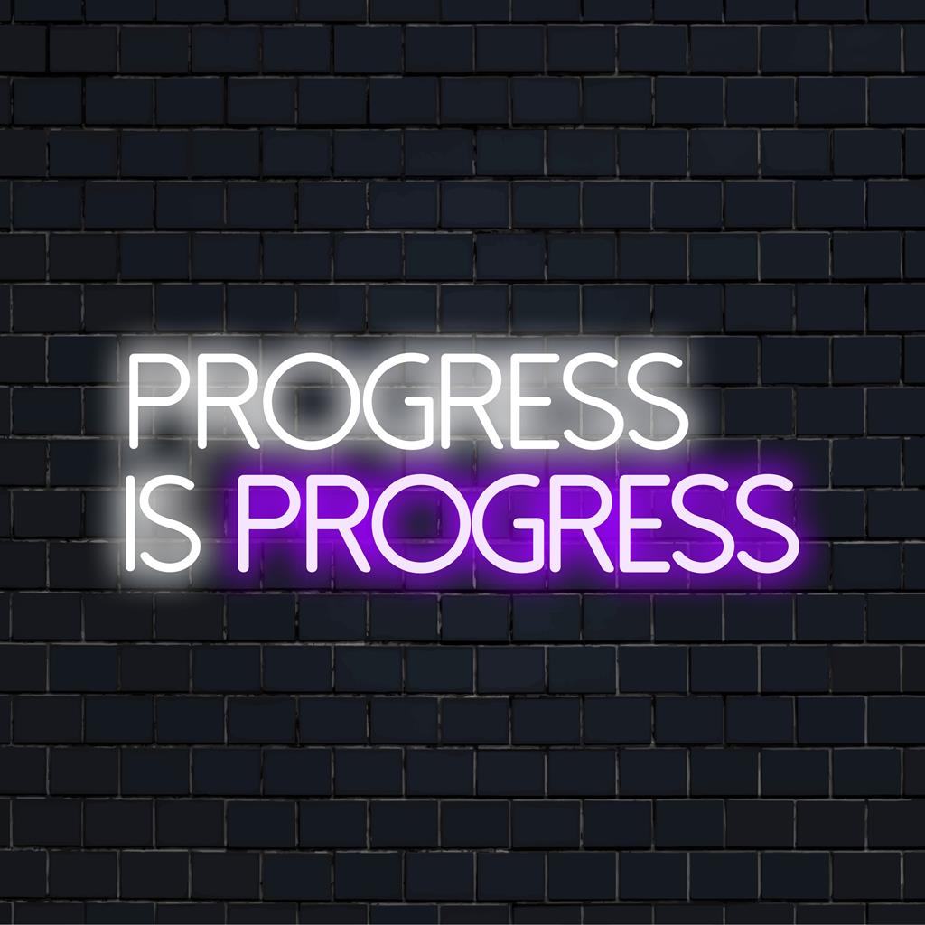 Op maat gemaakt LED-neonbord met de tekst Progress Is Progress in levendige kleuren, ideaal voor een moderne inrichting en inspiratie.