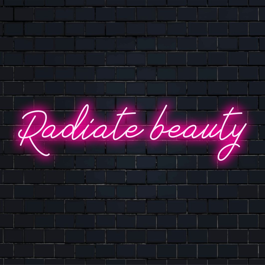 Op maat gemaakt LED-neonbord van het merk The Art Neon met de tekst Radiate Beauty in levendige neonkleuren.