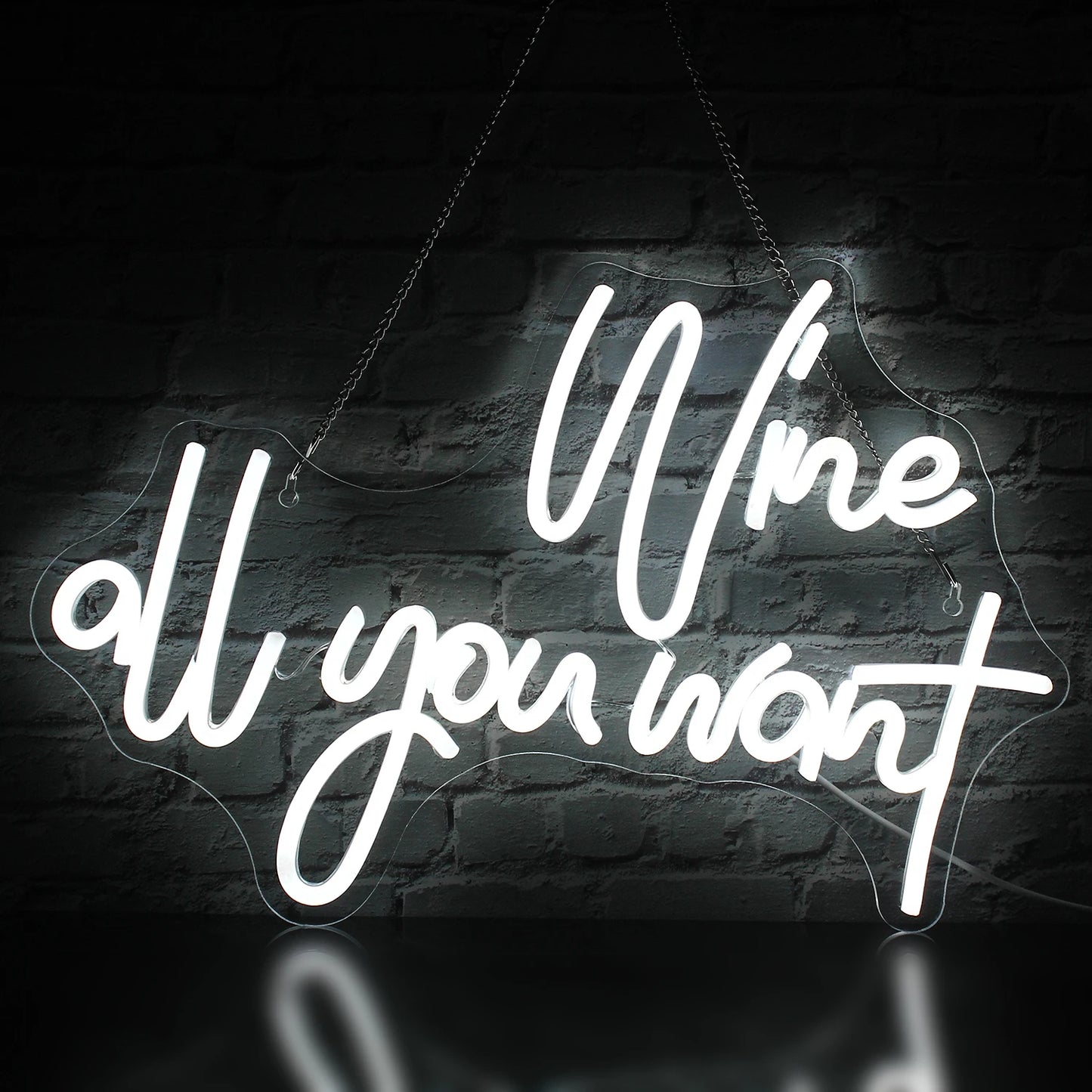 Op de afbeelding is een opvallend led-neonbord te zien met de tekst "Wine all you want" in sierlijke, cursieve letters.