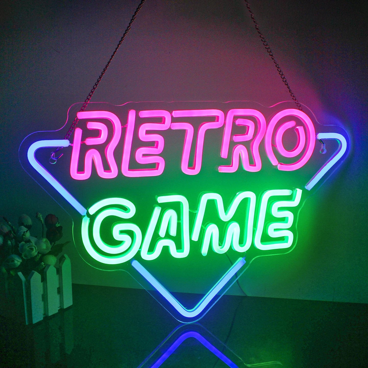 Op de afbeelding is een retro-led-neonbord met gamethema te zien dat prachtig oplicht in levendige kleuren.