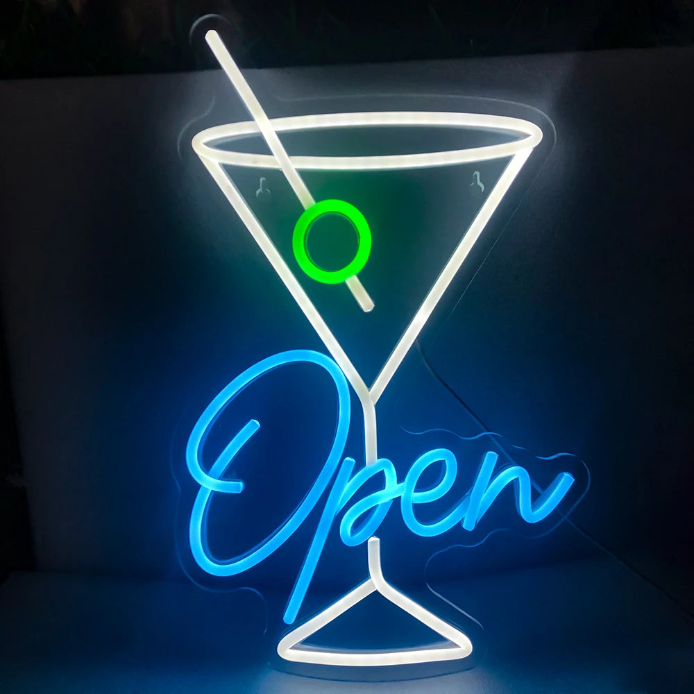 De afbeelding toont een levendig LED-neonbord in de vorm van een open wijnglas.