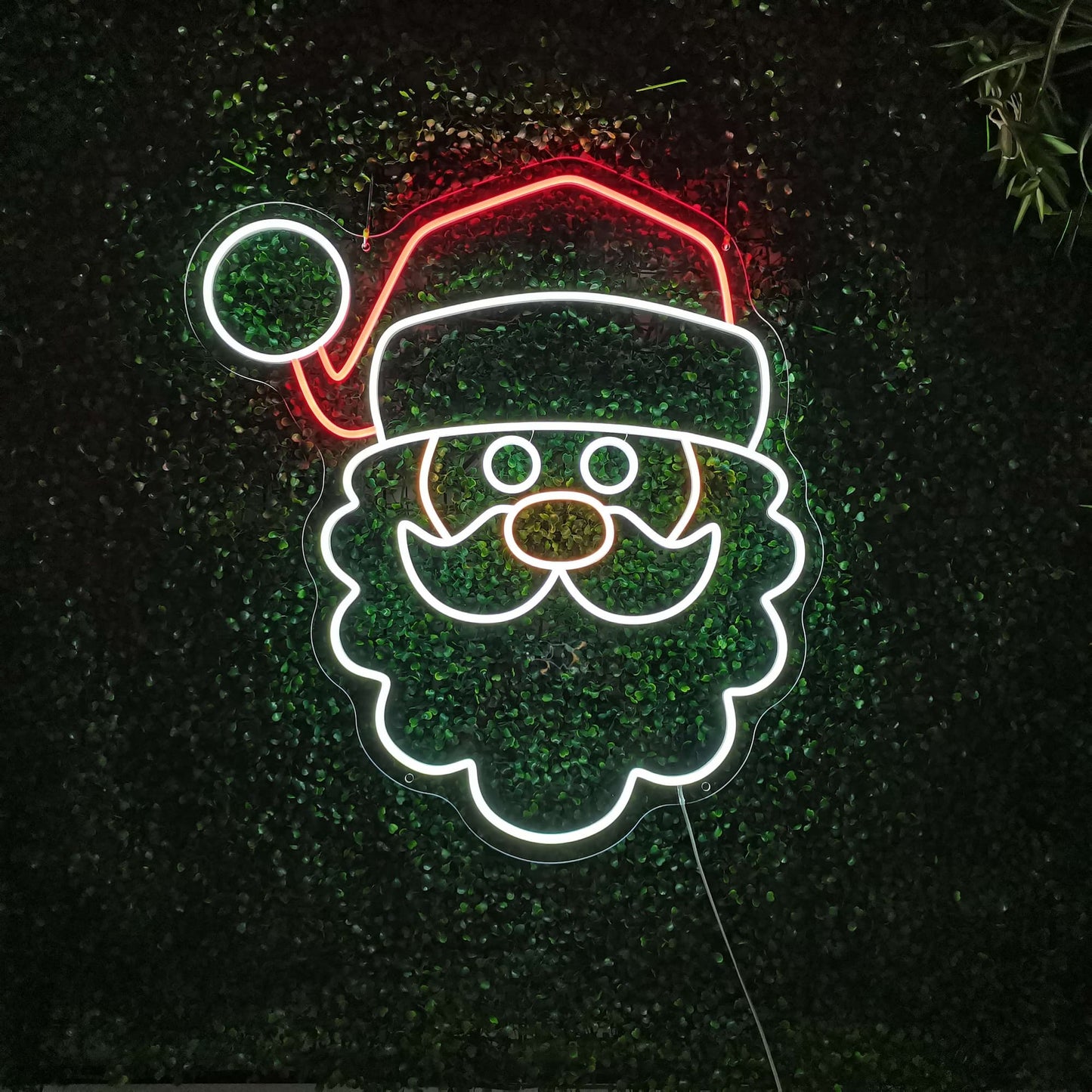 Neonreclame met het gezicht van de Kerstman - The Art Neon