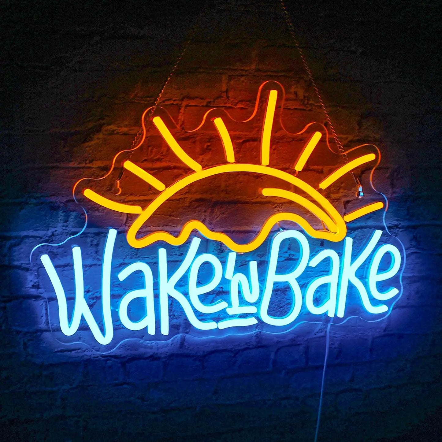 Op de afbeelding is een levendig, handgemaakt LED-neonbord te zien met de speelse tekst "Wake n' Bake" in een stijlvol, cursief lettertype.