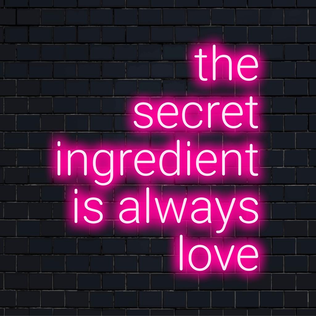 Aangepast LED-neonbord met de tekst The Secret Ingredient Is Always Love in boeiende, cursieve letters, perfect voor elke muurdecoratie.