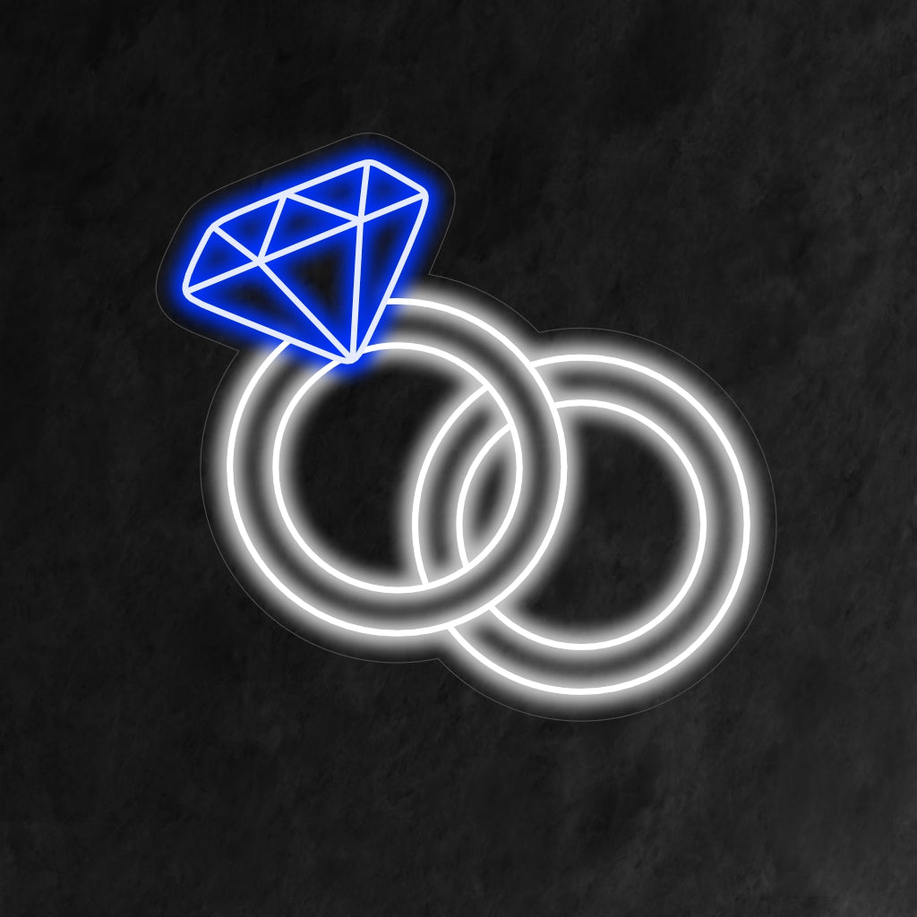 "Wedding Rings Neon Sign" symboliseert eeuwige liefde met een zacht licht, en creëert een romantische sfeer die de verbintenis van twee harten viert.