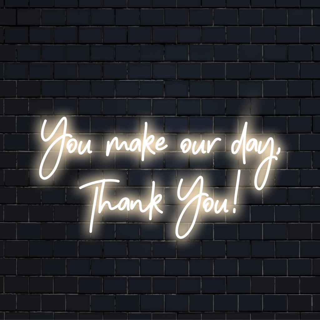 Een aangepast LED-neonbord met de tekst You Make Our Day, Thank You! combineert tekstkunst met een stralende waardering, perfect voor elke ruimte.
