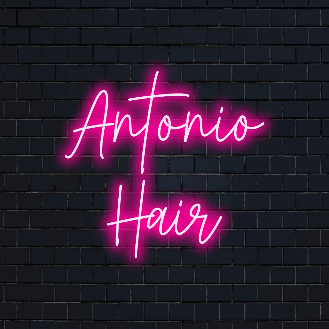 Antonio Hair Custom Name Neon Sign, soft neon glow against black brick wall