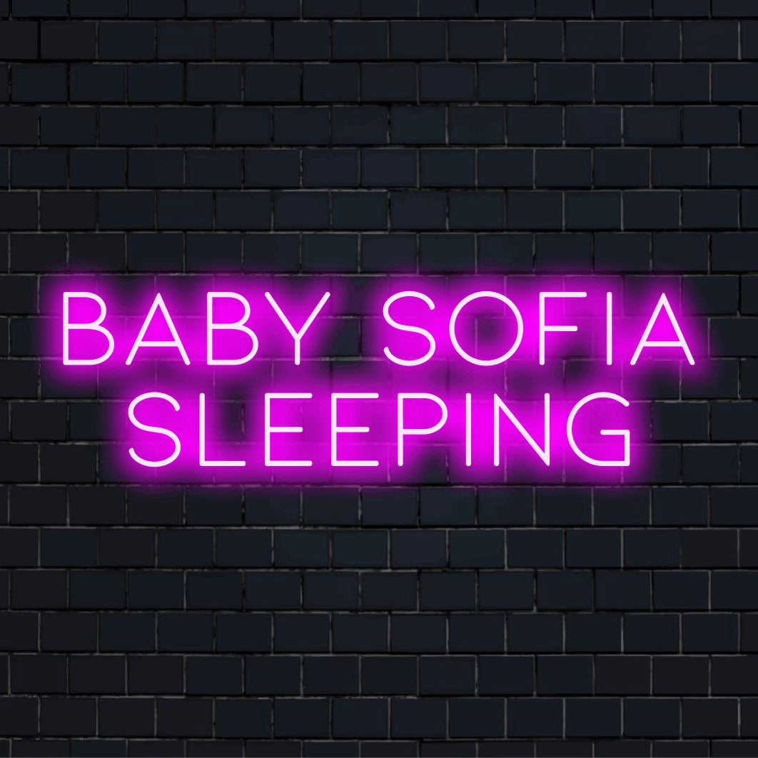 Baby Sofia Sleeping Custom Name Neon Sign, bright neon lettering on black brick background