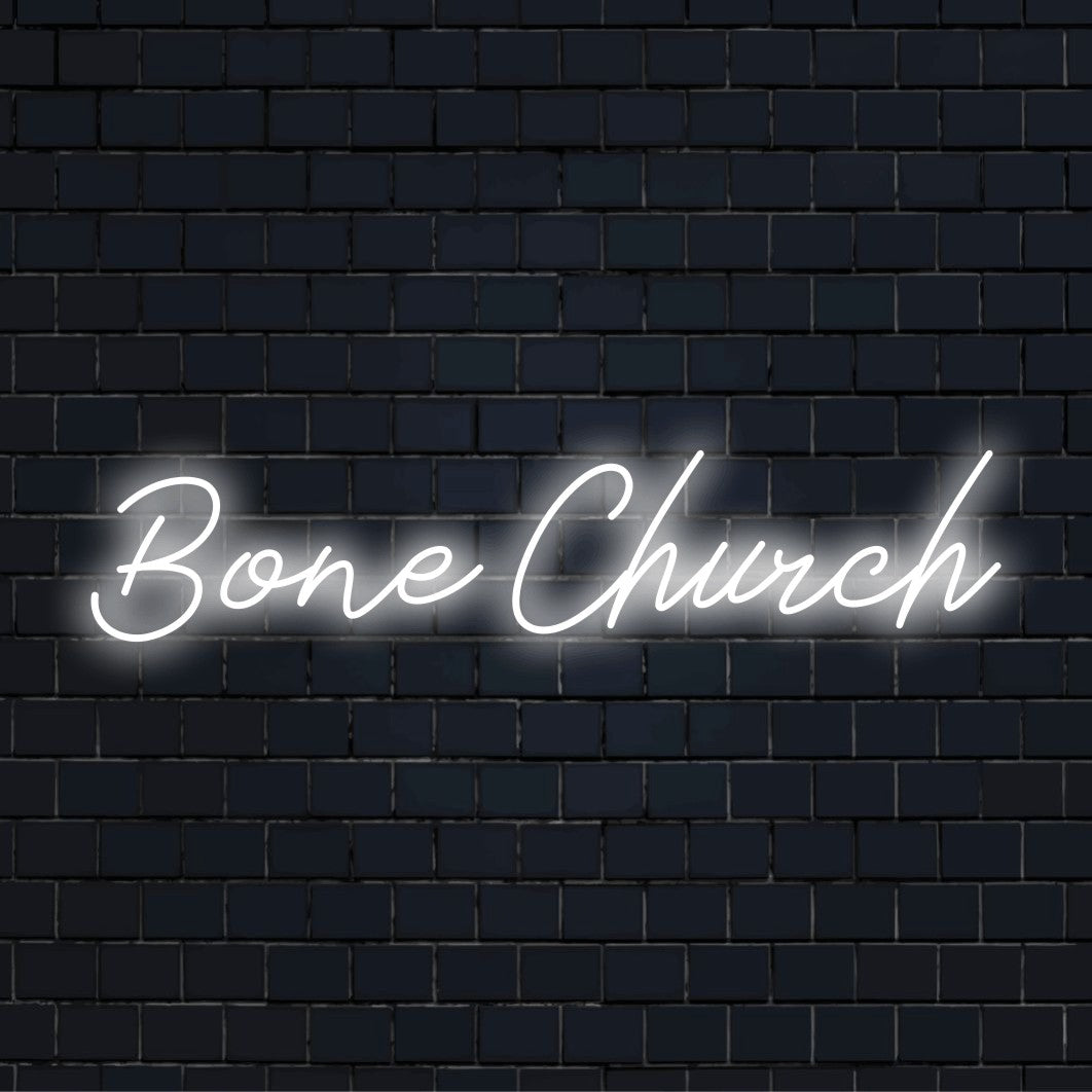 Bone Church Neon Light with bright neon glow on dark brick background