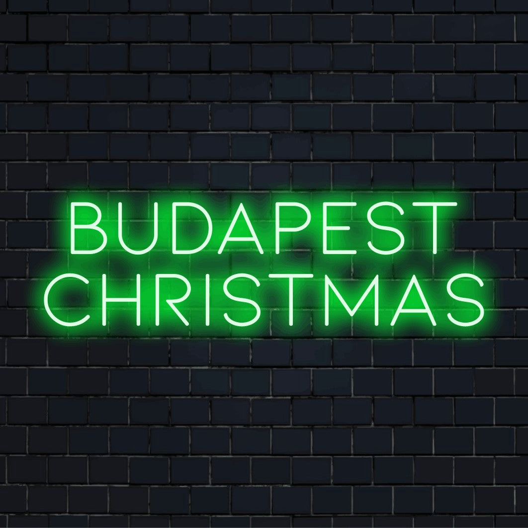 Budapest Christmas LED Neon Sign, soft neon glow against brick backdrop