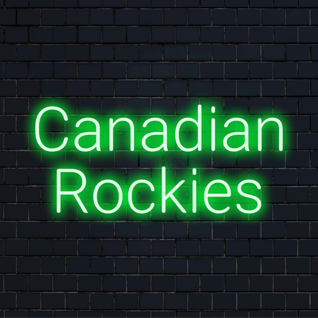 Canadian Rockies Neon Sign, glowing wall decor against black brick wall