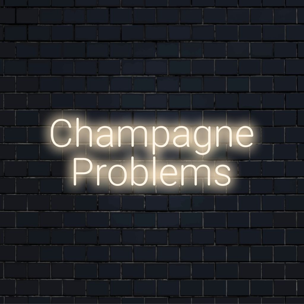 Champagne Problems Neon Sign, glowing wall decor on dark brick background