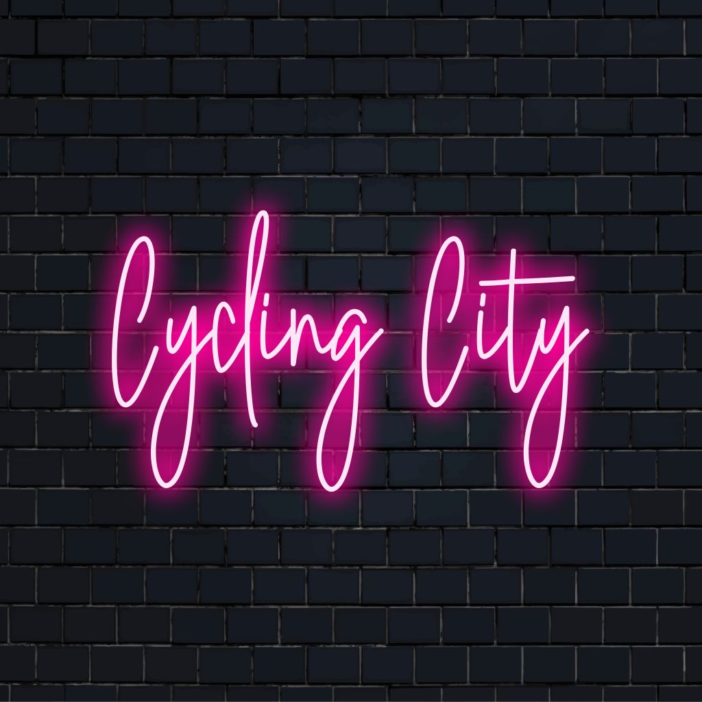 Cycling City LED Neon Sign, glowing lettering on dark brick background