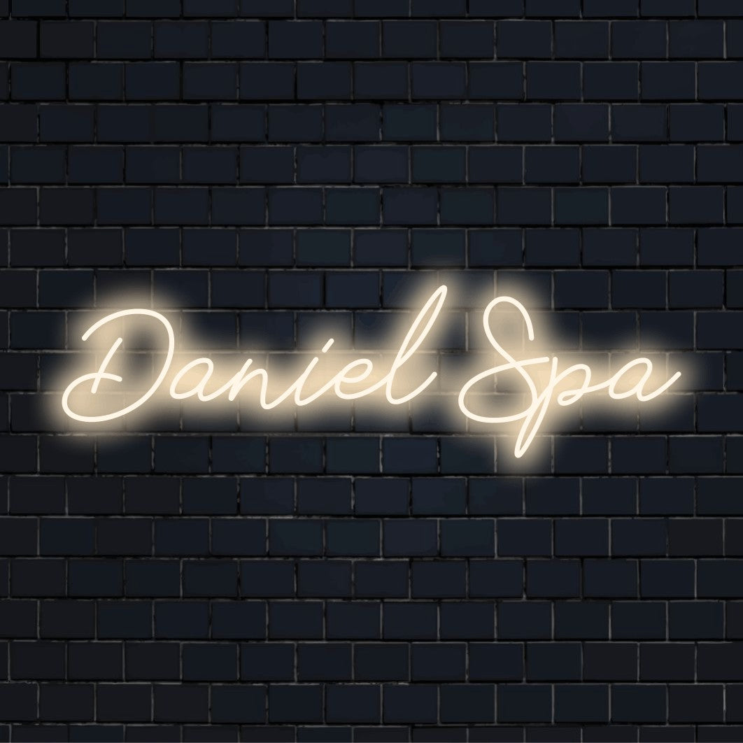 Daniel Spa Custom Name Neon Sign, bright neon glow on dark brick background