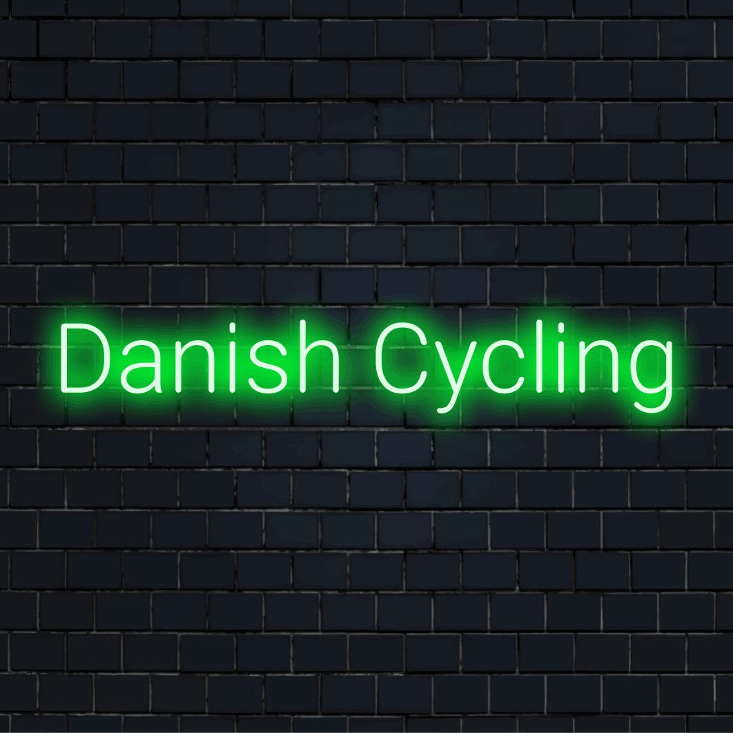 Danish Cycling Neon Sign, bright neon glow against brick backdrop
