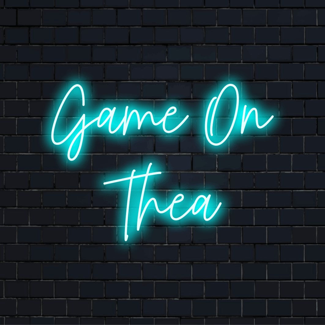 Game On Thea Personalized Neon Light with glowing lettering on black brick background