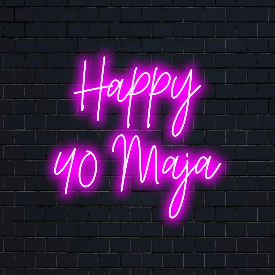 Happy 40 Maja Personalized Neon Light with bright neon lettering on dark brick wall