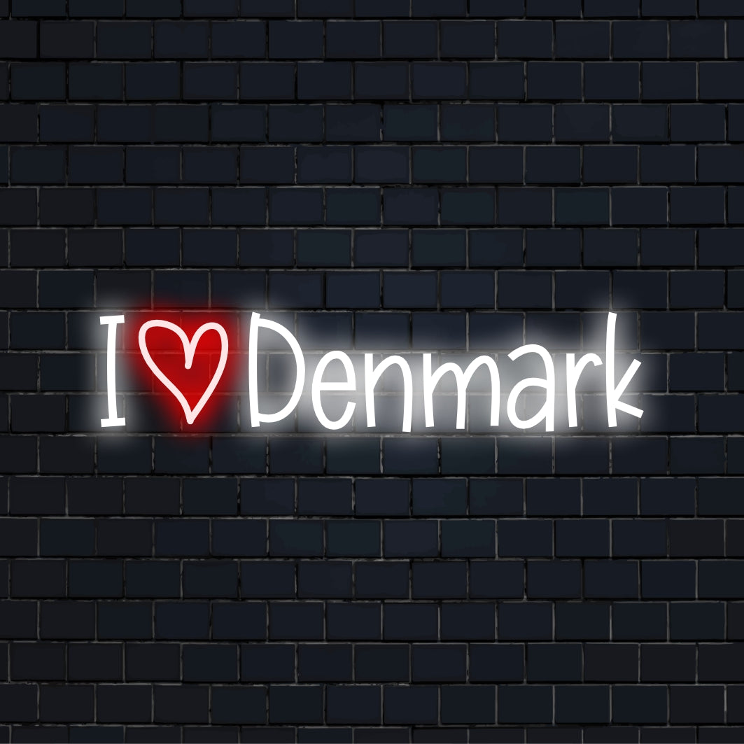 I Love Denmark Neon Sign, glowing neon text against black brick wall