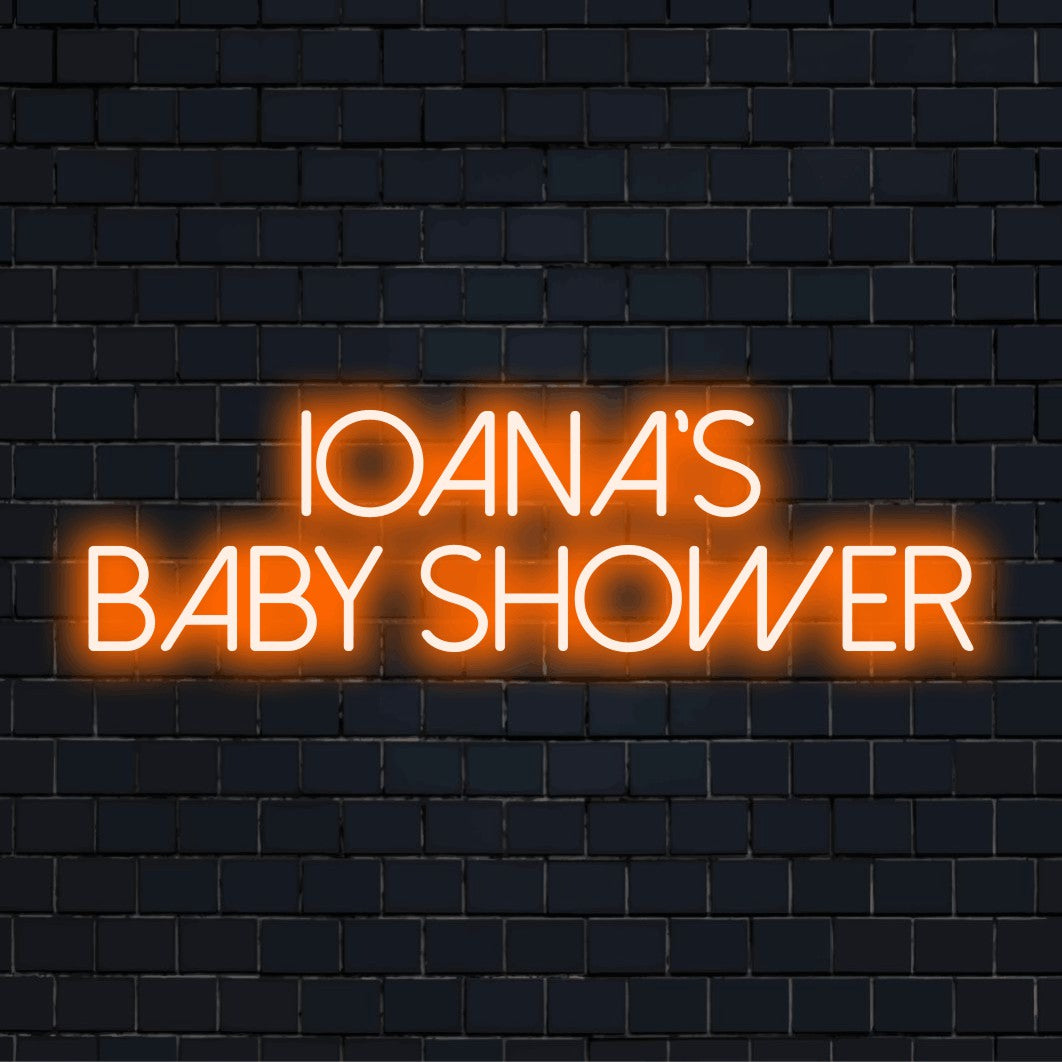 Ioana_s Baby Shower Custom Name Neon Sign, neon text light on dark brick wall