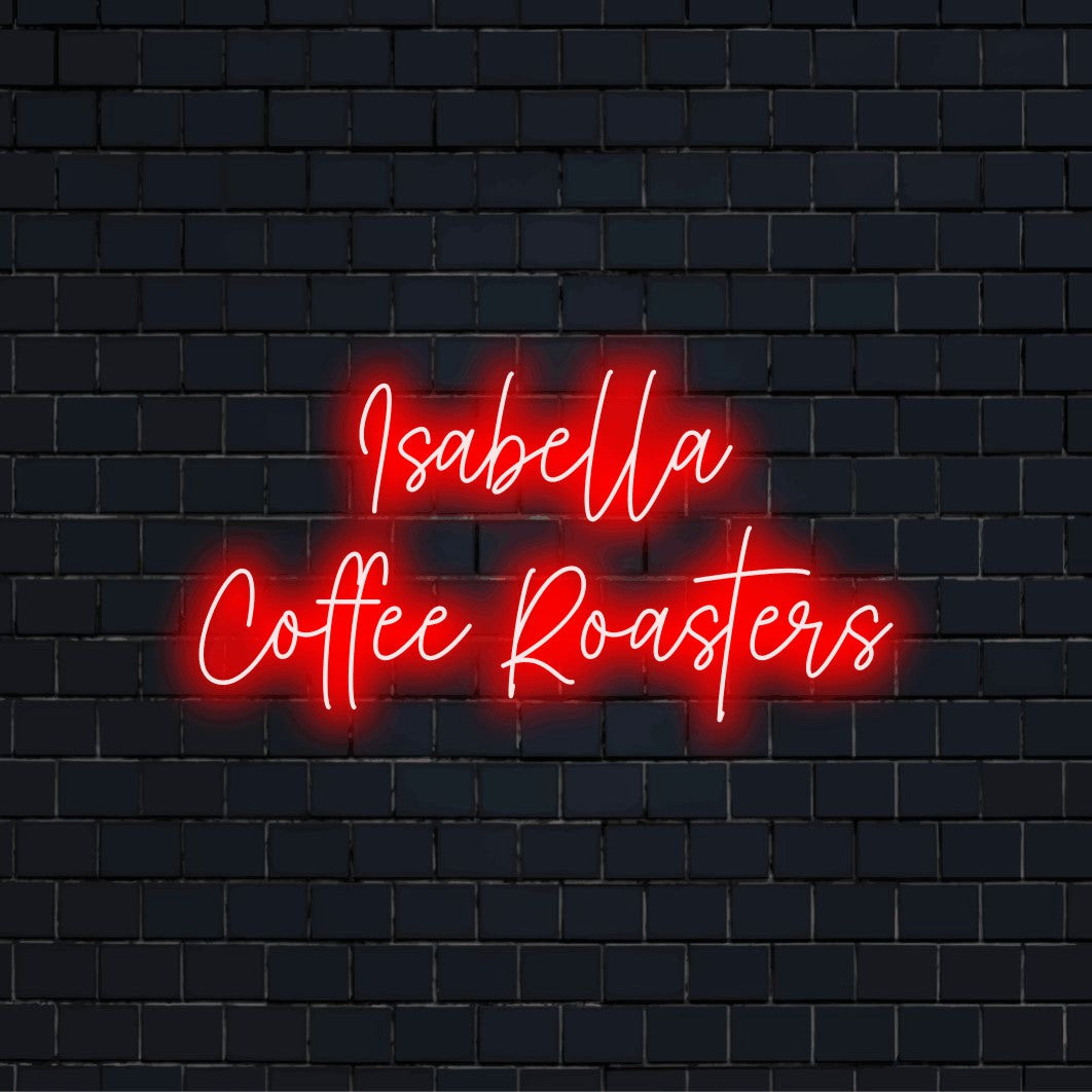 Isabella Coffee Roasters Custom Name Neon Sign, glowing wall decor against brick backdrop