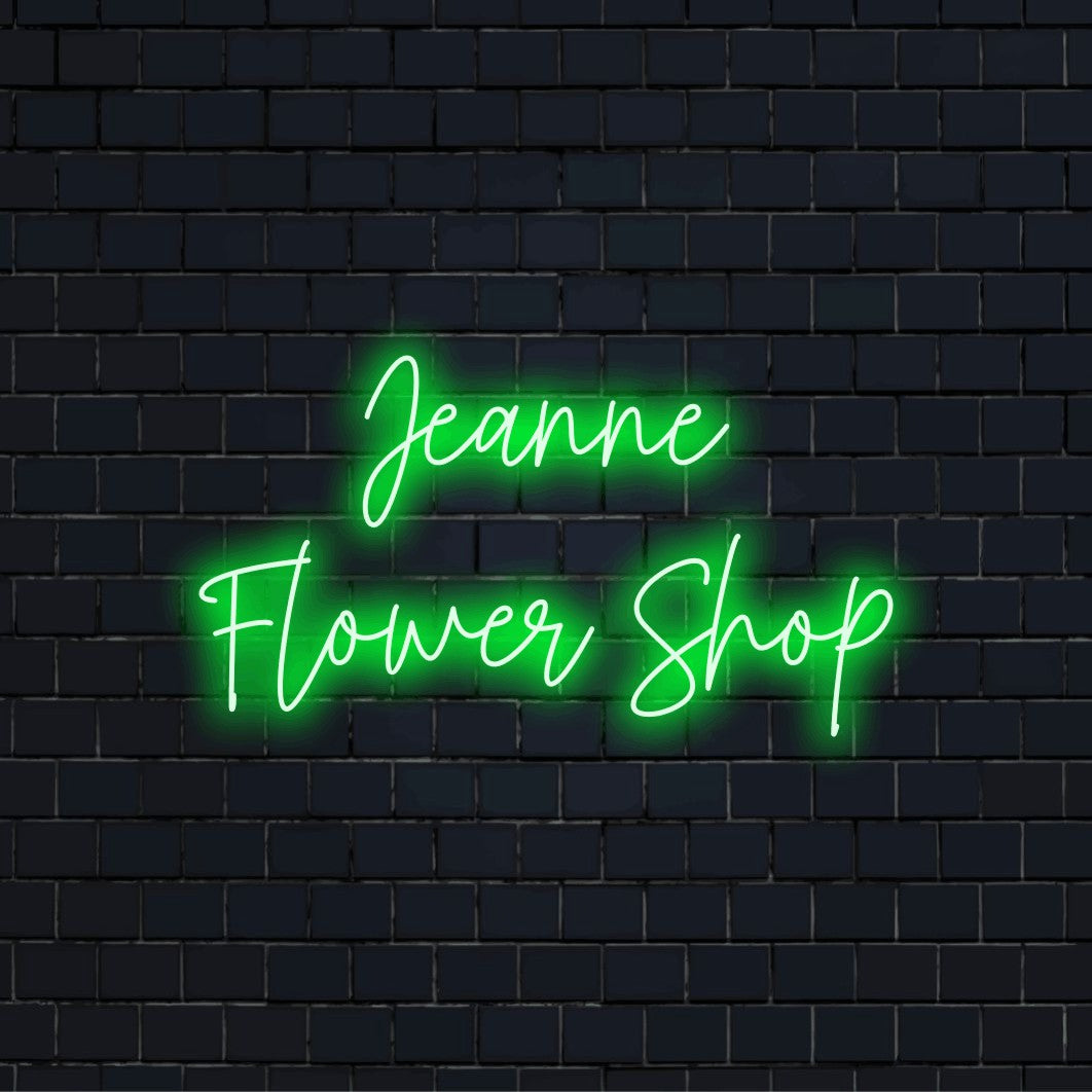 Jeanne Flower Shop Custom Name Neon Sign, soft neon glow on dark brick wall