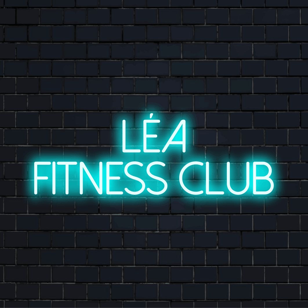 Lea Fitness Club Custom Name Neon Sign, glowing lettering against brick backdrop