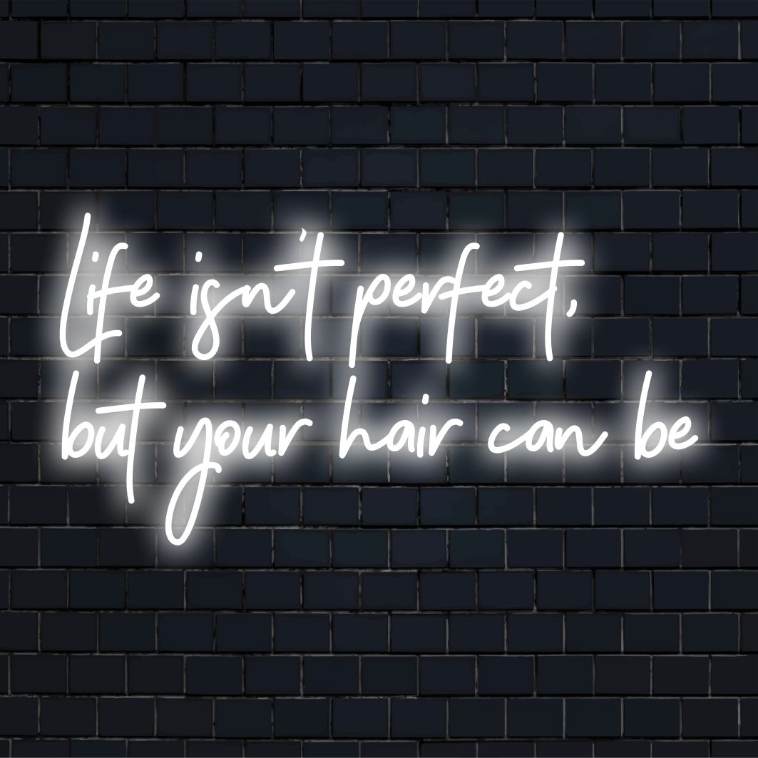Op maat gemaakt LED-neonbord met de tekst Life Isn't Perfect, But Your Hair Can Be in levendige, stijlvolle letters.