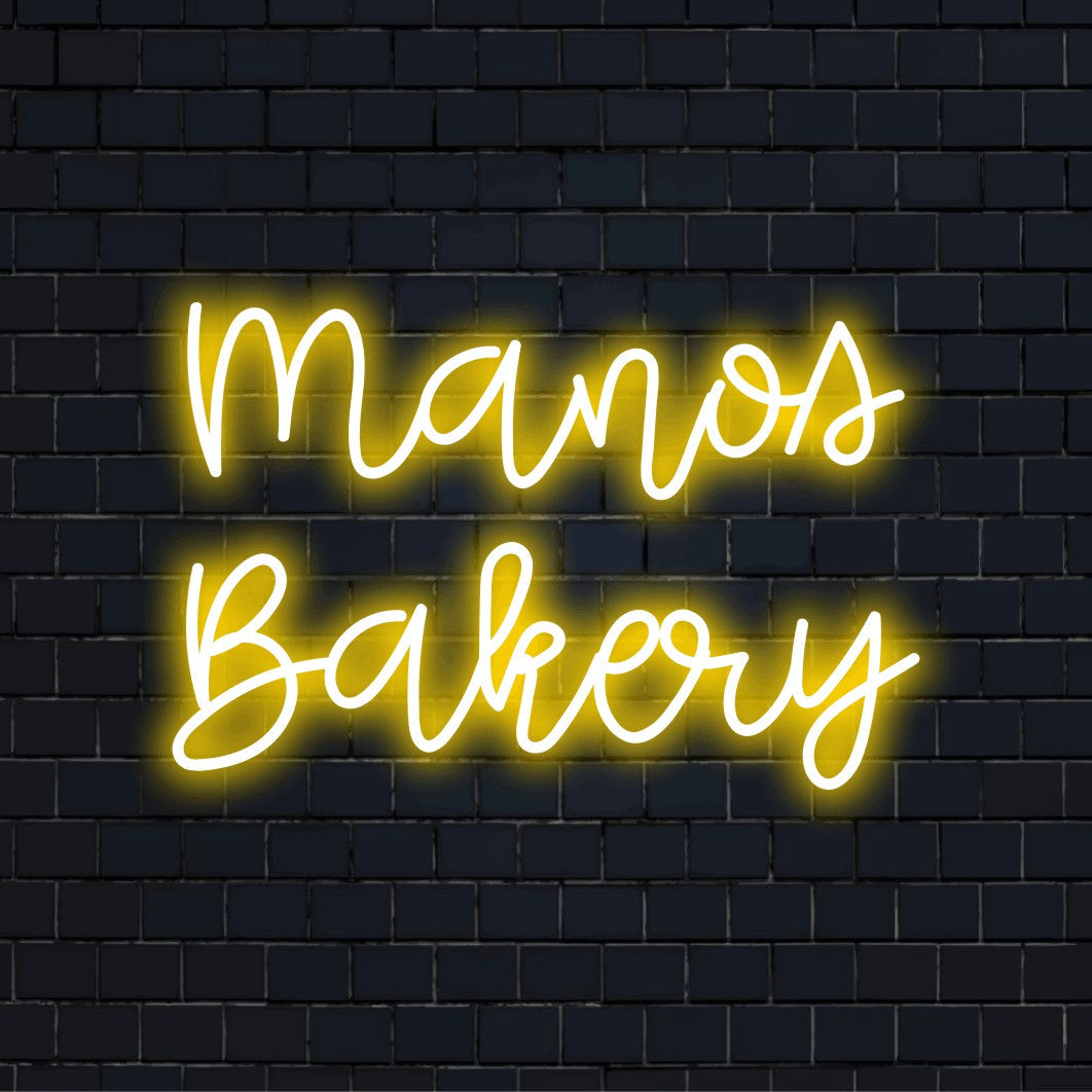 Manos Bakery Personalized Neon Light with neon text light on black brick background