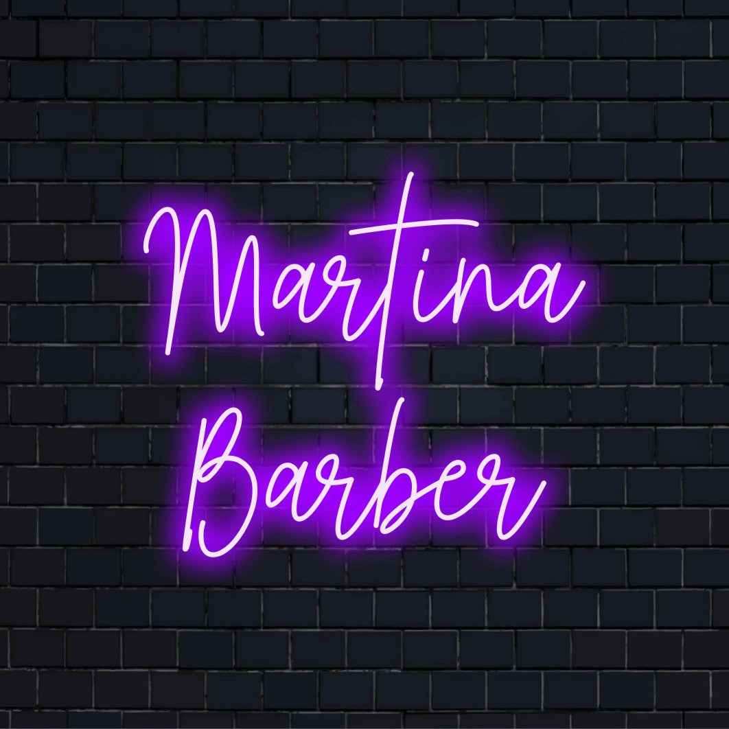 Martina Barber Personalized Neon Light with glowing neon text against black brick wall