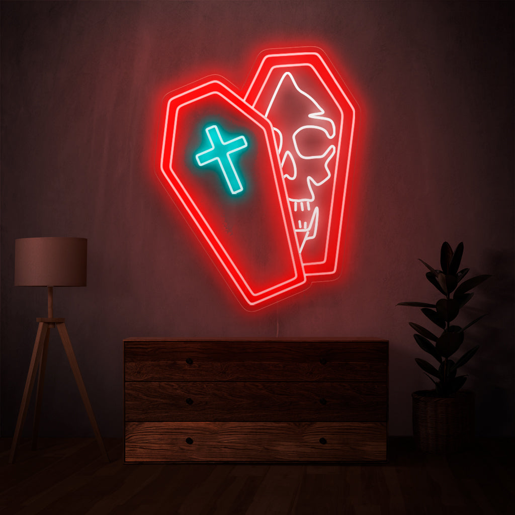 Het neonlicht met een schedel in een doodskist is een macabere toevoeging aan een griezelig decor, omdat het een griezelig en betoverend licht uitstraalt.
