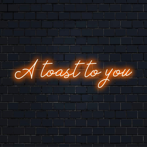 Speciaal LED-neonbord met de tekst A Toast To You in levendige kleuren, perfect om elke ruimte een feestelijk tintje te geven.