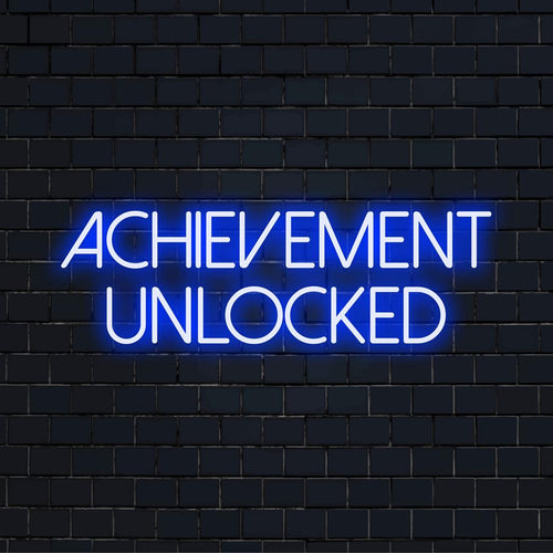 Levendig LED-neonbord met de oplichtende tekst Achievement Unlocked, perfect om elke ruimte te verlevendigen met een modern design.