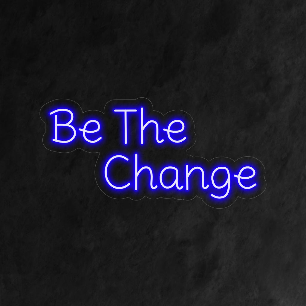 "Be the Change Neon Sign" - Een krachtig neonlicht met een inspirerende boodschap, dat positiviteit en empowerment in uw leefruimte brengt.