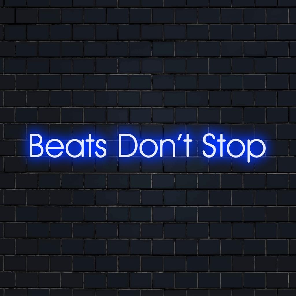 Custom LED neon sign with the phrase Beats Don't Stop, showcasing vibrant neon art for decor and ambiance.