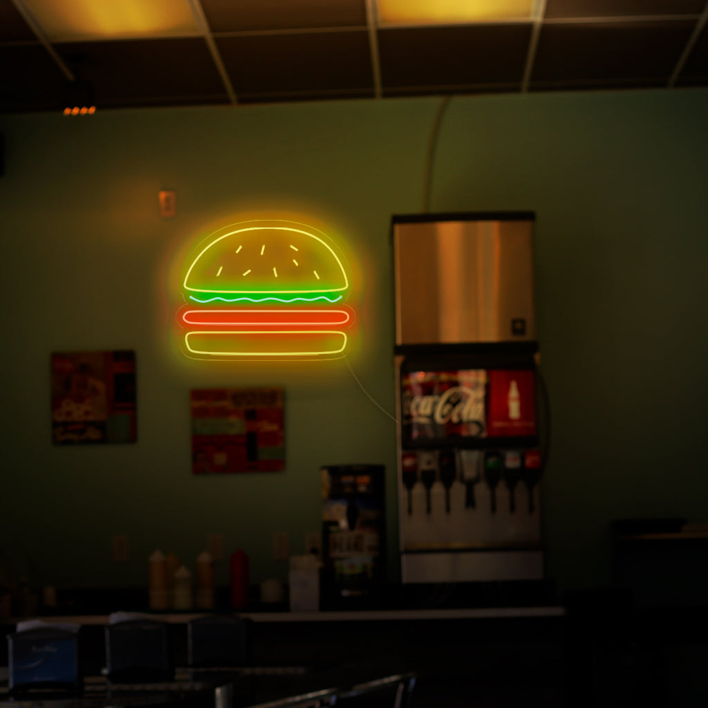 "Burger Neon Sign" - Een overheerlijk neonlicht met het iconische symbool van een hamburger. Het zorgt voor een sfeer van heerlijk eten en liefde voor klassieke fastfoodfavorieten in uw hamburgertent of restaurant.